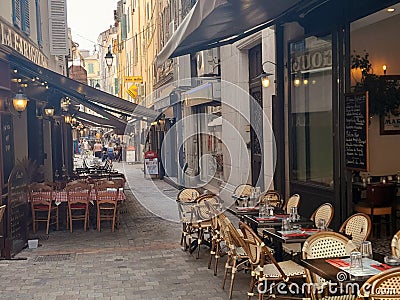 Restaurants in Cannes, France, with empty chairs and tables Editorial Stock Photo