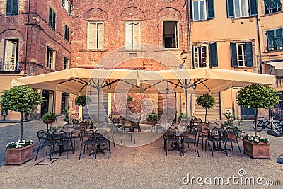Restaurants on historic streets of Lucca,Tuscany,Italy Stock Photo