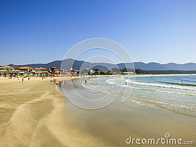 Restaurants and people enjoying the sunny day at Barra da Lagoa beach in Florianopolis, Brazil Editorial Stock Photo