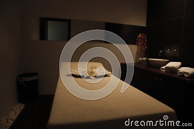 Restful bed in massage room of a spa Stock Photo