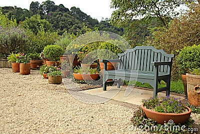 Resting bench in middle beautiful garden Stock Photo