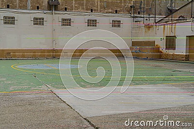 resting place for prisoners in the prison yard next to the basketball field Stock Photo