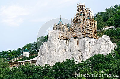 Restoration of christian church on stone rock mountain in the forest Stock Photo