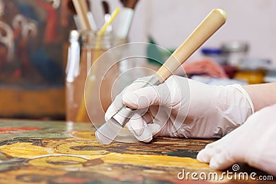 Restoration and gilding ancient Christian icon Stock Photo