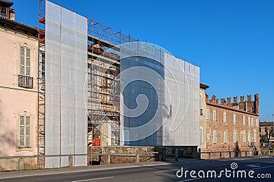 Restoration restore scaffolding castle panorama landscape vision detail work worker Italy Italian Editorial Stock Photo