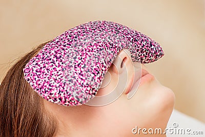 Restorative eye pillow covers eyes Stock Photo