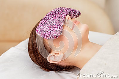 Restorative eye pillow covers eyes. Stock Photo