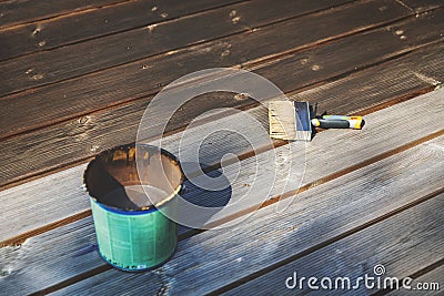 Restore old wooden terrace with wood protective oil Stock Photo