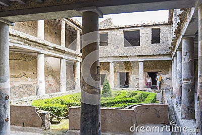 The restored courtyard of the few buildings still completely intact in the ash-burdened city of Pompeii, Italy Editorial Stock Photo