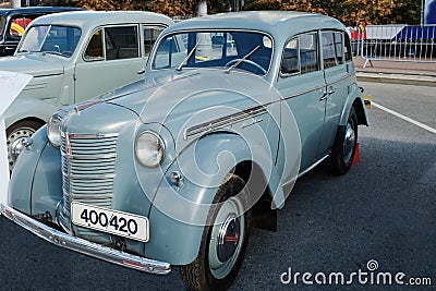 Restored old-fashioned soviet retro car. Vintage soviet retro automobile Moskvich-400 in the historical center of Moscow, Russia Editorial Stock Photo