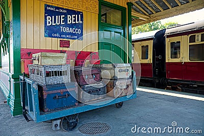 Retro style suitcases on train station platform Editorial Stock Photo