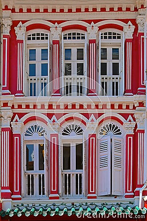 Red peranakan house with white windows Stock Photo