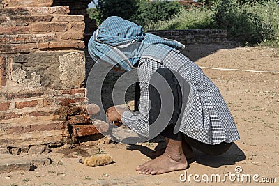 Restorative woman working, Bagan Stock Photo