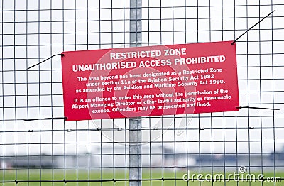 Restricted air space zone sign at airport barrier fence no unauthorised access Stock Photo