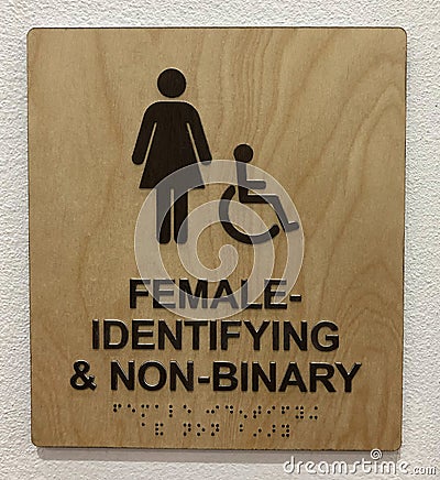 Restroom sign for femail identifying and non-binary Stock Photo