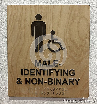 Restroom sign for male identifying & non-binary Stock Photo