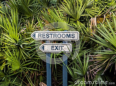 Restrooms and Exit Arrow Sign at a Public Park Stock Photo