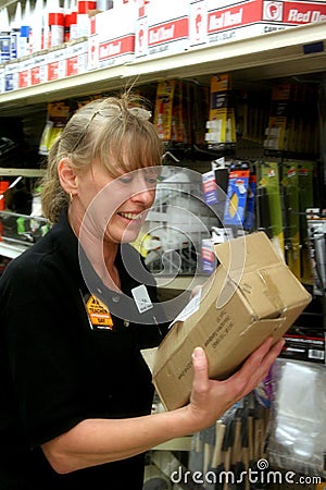 Retail Associate Putting out Stock Stock Photo