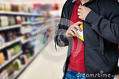 Retail Shoplifting. Man Stealing In Supermarket Stock Photo
