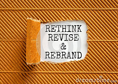 Rethink revise rebrand symbol. Concept word Rethink Revise and Rebrand on beautiful paper. Beautiful brown paper background. Stock Photo