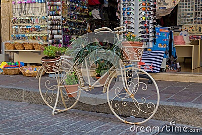 Rethymno, Greece - August 2, 2016: Bicycle with flowers in fron Editorial Stock Photo