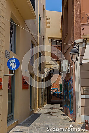 Rethymno, Greece - August 5, 2016: Narrow venetian street in o Editorial Stock Photo