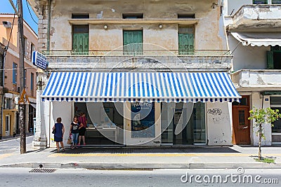 Rethymnon, Island Crete, Greece, - July 1, 2016: Local citizens are speaking with each other near fish store with fresh seafood Editorial Stock Photo