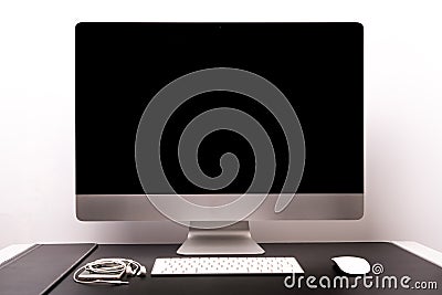 Retina display with keyboard, mouse, smart phone and earphone Stock Photo