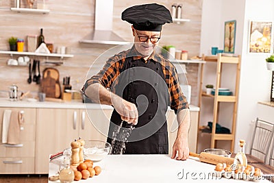 Retired chef in home kitchen Stock Photo