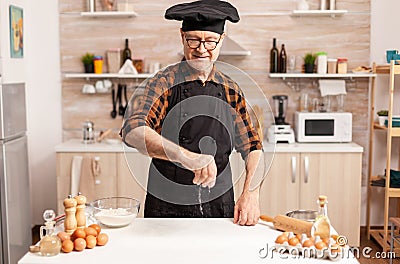 Retired cook preparing food Stock Photo