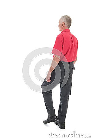 Retired man walking away Stock Photo