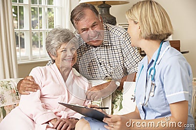 Retired Senior Woman Having Health Check With Nurse At Home Stock Photo