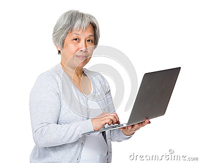 Retired woman learn to use laptop Stock Photo