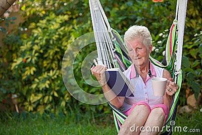 Retired woman reading Stock Photo