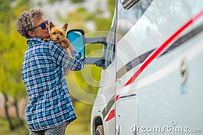 Retired Woman on the Road Trip with Her Dog Stock Photo