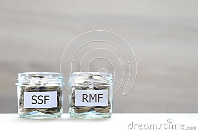 Retirement Mutual Fund, Coins money in the glass bottle on white background, Save money for prepare in future and pension Stock Photo