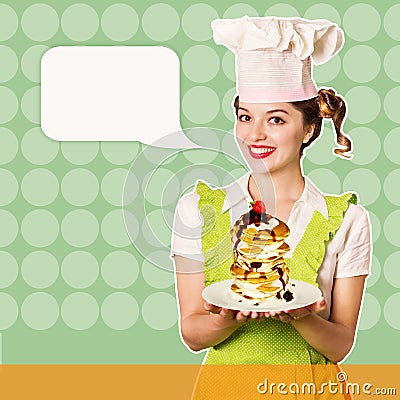 Reto smiling housewife in chef hat cooks pancakes Stock Photo