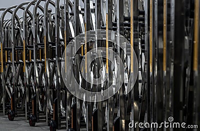 Retractable stainless steel barrier installed as a fence used to keep unauthorized people into the property. Aluminium alloy Stock Photo