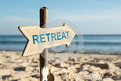 Retreat Arrow Sign On Beach Stock Photo