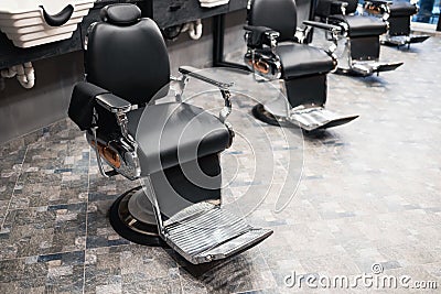 Retro armchairs in a men`s barbershop. Stock Photo