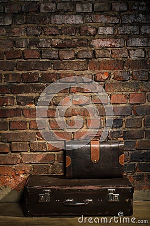 Retro bags on brick wall background Stock Photo