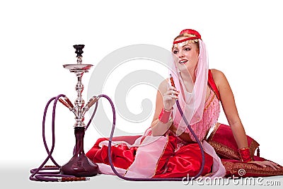 Retro belly dancer posing with hookah Stock Photo