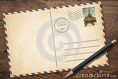 Retro blank postcard with pen on old wood table Stock Photo