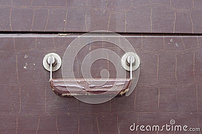 Retro brown handle on a closed suitcase Stock Photo