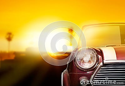 Retro car head light on street in the sunset background Stock Photo