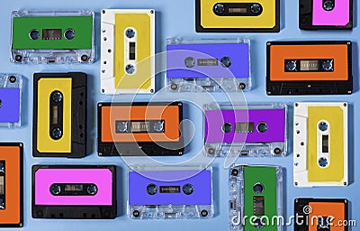 Retro cassette tape collection on blue background. Stock Photo