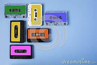 Retro cassette tape collection on blue background. Stock Photo