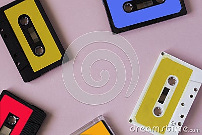 Retro cassette tape collection on pink background, top view. cop Stock Photo