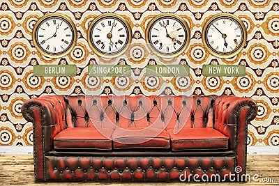 Retro chesterfield sofa with world time clocks on a wall Stock Photo
