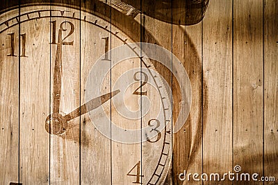 Retro clock on wood background selective focus at number 2 o`clock Stock Photo